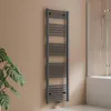 A dark grey towel radiator is mounted on a light brown wall next to a bathtub with a glass shower screen. Produktbild-Vorschau