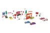 A collection of toy cars and accessories, including a gas station, police car, and traffic signs, arranged on a white background. Produktbild-Vorschau