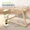 Close-up marketing image of a wooden children's climbing frame, highlighting safety features. Podgląd zdjęcia produktu