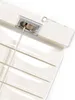 A close-up view of the top mechanism of a cream-colored blind, showing the cord winding mechanism. Produktbild-Vorschau