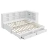 A white daybed with a slatted mattress base, built-in shelving units along the headboard, and two pull-out drawers underneath. Produktbild-Vorschau