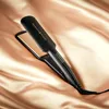 A black Remington Proluxe hair straightener with gold plates rests on a draped gold satin fabric. Anteprima dell’immagine prodotto