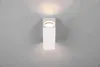 A white, rectangular wall light fixture is mounted on a gray wall, emitting a warm light upwards and downwards. Produktbild-Vorschau