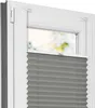A close-up view of a gray pleated blind installed in a white window frame. Produktbild-Vorschau