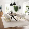 A dining room setting with a table and chairs. Produktbild-Vorschau
