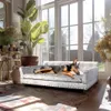 A dog is resting on a pet sofa in a sunlit room with large windows and plants. Podgląd zdjęcia produktu