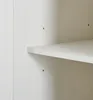 A close-up view of the interior of a white cabinet or shelf unit, showing a shelf and the side panel with small holes. Anteprima dell’immagine prodotto