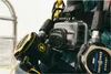 A close-up shot of a diver's gear, including a GoPro camera in a protective housing and parts of a regulator. Voir les images du produit