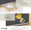 A collage of product features, showing a mounting bracket, text about custom production, and a magnetic toy figure. Náhled obrázku produktu
