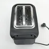 A top-down view of a black and silver toaster on a white background. Voir les images du produit