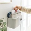 A hand is placing a document into a wall-mounted document organizer. Produktbild-Vorschau