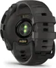 The back of a black smartwatch with a heart rate sensor and charging contacts. Náhľad obrázku produktu