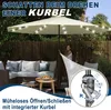 A woman is operating a patio umbrella with integrated LED lights, set up on a patio with outdoor furniture. Náhled obrázku produktu
