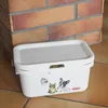 A white plastic storage box with cartoon animal decals is placed on a tiled floor in front of a brick wall. Anteprima dell’immagine prodotto