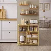 A kitchen shelf unit filled with various kitchen items, including storage containers, a kettle, and bags of coffee. Produktbild-Vorschau