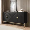 A black sideboard with geometric front and gold handles is displayed in a room with curtains and wall paneling. Produktbild-Vorschau