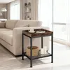 A side table next to a sofa in a living room. Produktbild-Vorschau