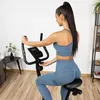 A woman is using a magnetic home trainer in a room. Náhľad obrázku produktu