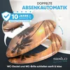 A toilet seat and lid with a tropical sunset design, featuring palm trees. Náhled obrázku produktu
