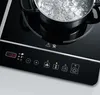 A close-up of a portable induction cooktop with a pot of boiling water on it. Náhľad obrázku produktu