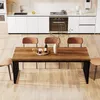 A dining table and chairs are set up in a modern kitchen. Produktbild-Vorschau