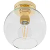 A close-up view of a gold and clear glass globe ceiling light fixture with an exposed filament bulb. Voir les images du produit