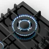 A close-up view of a gas stove burner with blue flames. Náhľad obrázku produktu