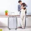 A couple embracing in a kitchen setting with a suitcase in the foreground. Anteprima dell’immagine prodotto
