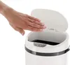 A hand is shown hovering over an open sensor trash can, demonstrating its automatic opening feature. Produktbild-Vorschau