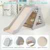 A wooden climbing triangle with a slide, set up indoors. Produktbild-Vorschau