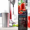 A close-up of a drink mixer with a recipe card and ingredients. Produktbild-Vorschau