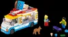 A LEGO ice cream truck with figures and accessories on a black background. Náhled obrázku produktu
