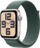 A close-up studio shot of a smartwatch with a green fabric band. Náhled obrázku produktu