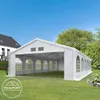 A large white party tent is set up on a grassy lawn in front of a house and trees. Produktbild-Vorschau