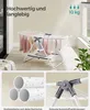 A SONGMICS small drying rack with clothes on it, shown in a room with a window and plants. Close-up shots of the material and joints are also included. Produktbild-Vorschau