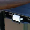 A close-up view of a white plastic component attached to the edge of a black plastic storage container. Anteprima dell’immagine prodotto
