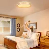 A mother is playing with her baby on a bed in a bedroom. Produktbild-Vorschau