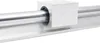 A close-up view of a linear bearing system, showing a metal shaft and a bearing block on a metal rail. Náhled obrázku produktu