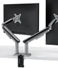 A dual monitor desk mount with two arms clamped to a white desk. Produktbild-Vorschau