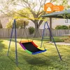 A colorful nest swing set in a backyard setting with a picnic table and fence in the background. Náhľad obrázku produktu