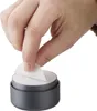 A hand is shown peeling a sticker from a furniture foot. Produktbild-Vorschau