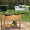A raised garden bed filled with herbs sits on a wooden deck, with a white garden bench and green cushion in the background. Produktbild-Vorschau