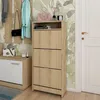 An entryway with a shoe cabinet, coat rack, and bench. Náhľad obrázku produktu