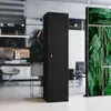 A black metal office cabinet is shown in a modern office setting with glass walls and plants. Náhľad obrázku produktu