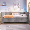 A bedroom scene with a daybed, shelves, and artwork on the wall. Podgląd zdjęcia produktu