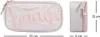 A cream-colored pencil case with pink embroidered lettering and a side view of the pencil case with dimensions indicated. Podgląd zdjęcia produktu