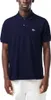 A man wearing a navy blue Lacoste polo shirt. Produktbild-Vorschau