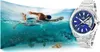 A man swimming underwater next to a watch. Produktbild-Vorschau