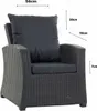 A close-up view of a dark grey rattan armchair with black cushions, featuring measurement indicators. Voir les images du produit