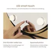 A close-up of a hand touching a smart touch mirror with LED lights. Podgląd zdjęcia produktu